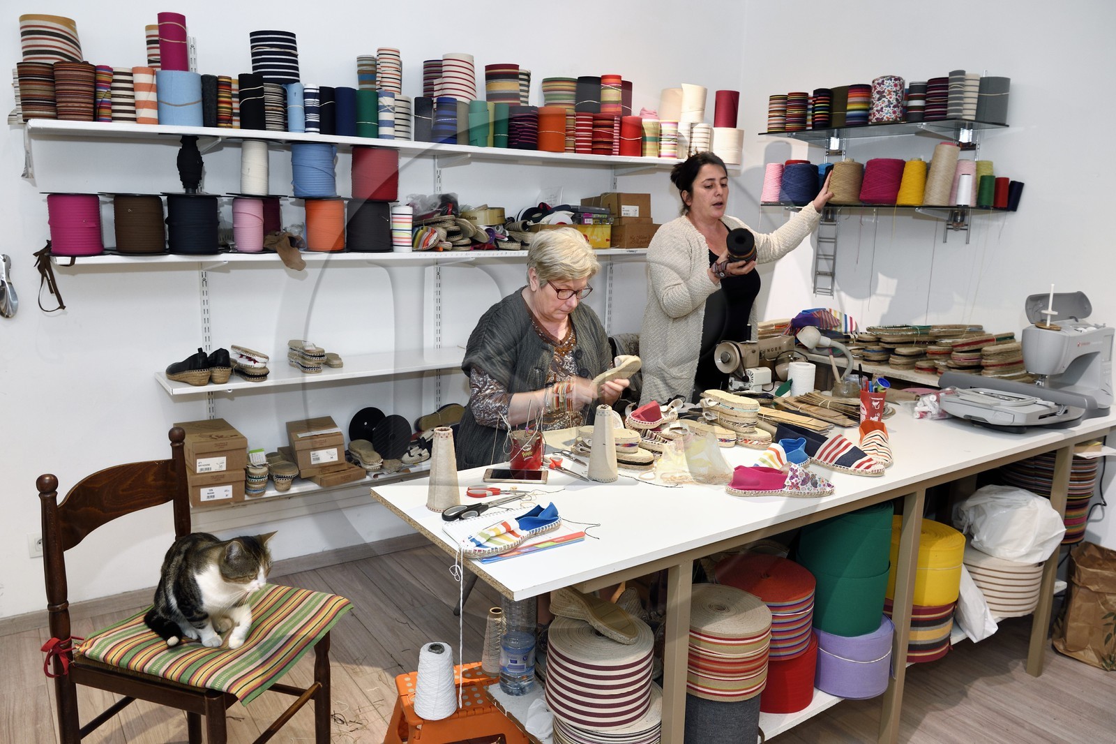 France, Pyrenees Atlantiques, Basque Country, Saint Jean Pied de Port, Albertine Arangois and her daughter Patricia in their shop and craft factory of espadrilles