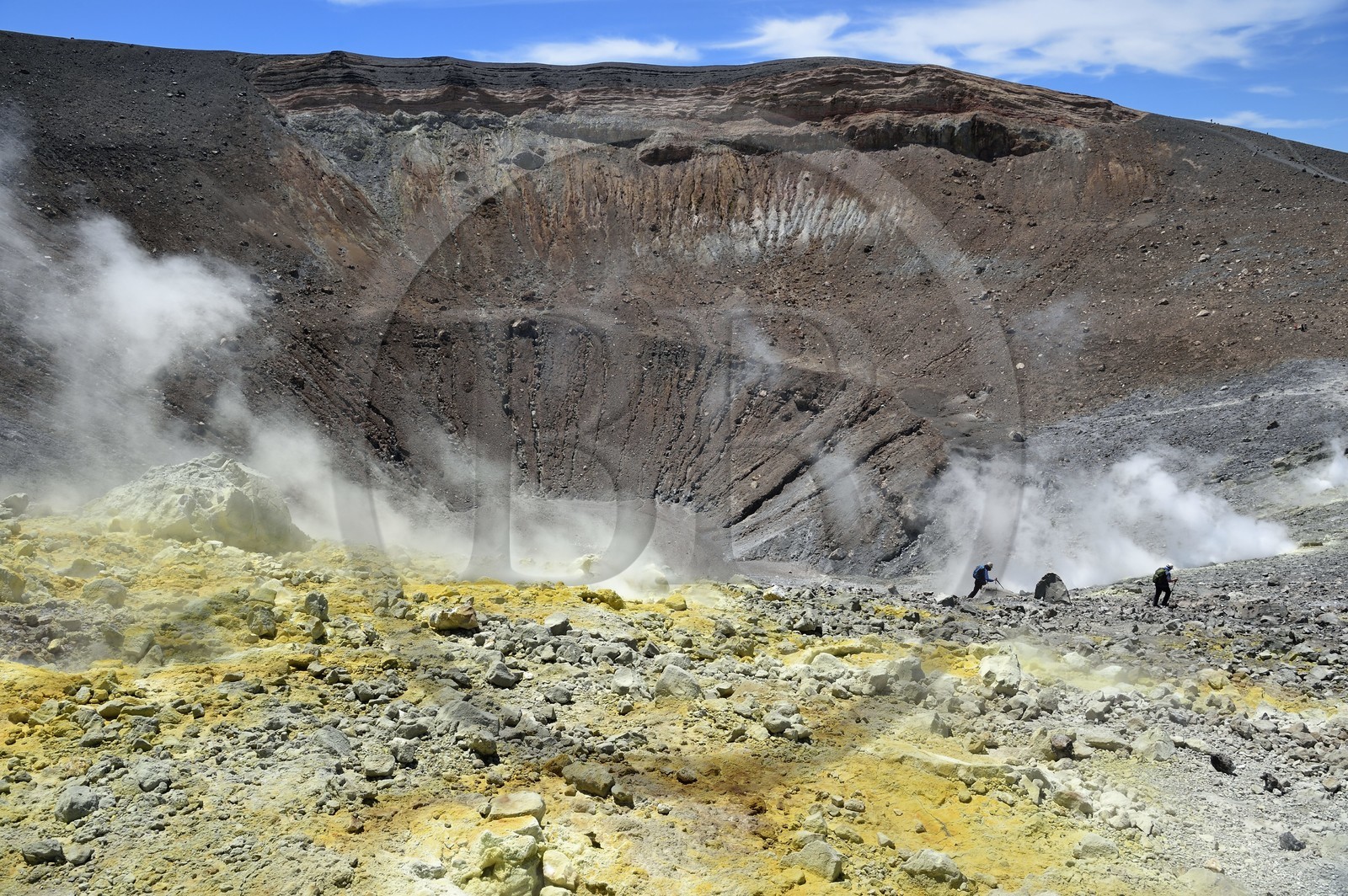 Italy, Sicily, Aeolian Islands, listed as World Heritage by UNESCO, Vulcano Island, hikers in the crater of volcano della Fossa and sulfur fumaroles