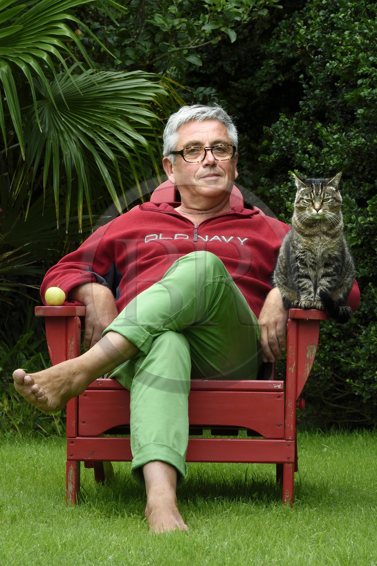 France, Finistere, Lannilis, Prat Ar Coum, the artist Loic Madec in his garden