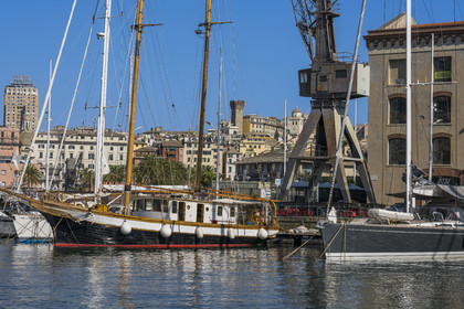 Italy, Liguria, Genoa, the Porto Antico (Old Port) and the Torre degli Embriaci, a 12th century medieval tower 41 meters high in the background