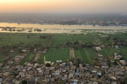 Egypt, Upper Egypt, Nile Valley, Luxor, a village of the West bank and the Nile in the background (aerial view)
