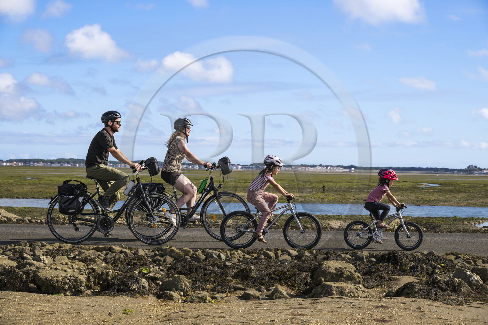 France, Vendee, Noirmoutier island, Barbatre, cyclists on the Passage du Gois, submersible causeway that connects the island to the mainland at low tide