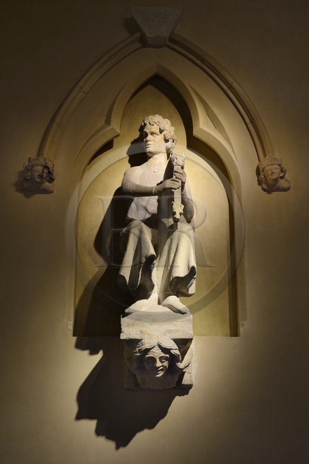 France, Marne, Reims, Saint-Remi Museum in the former Royal Abbey of Saint-Remi, reconstruction of a 13th century house facade destroyed in 1917 and decorated with five original sculptures, bagpiper