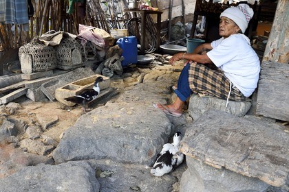 Philippines, Ifugao province, village of Batad, old woman sitting in front of her house