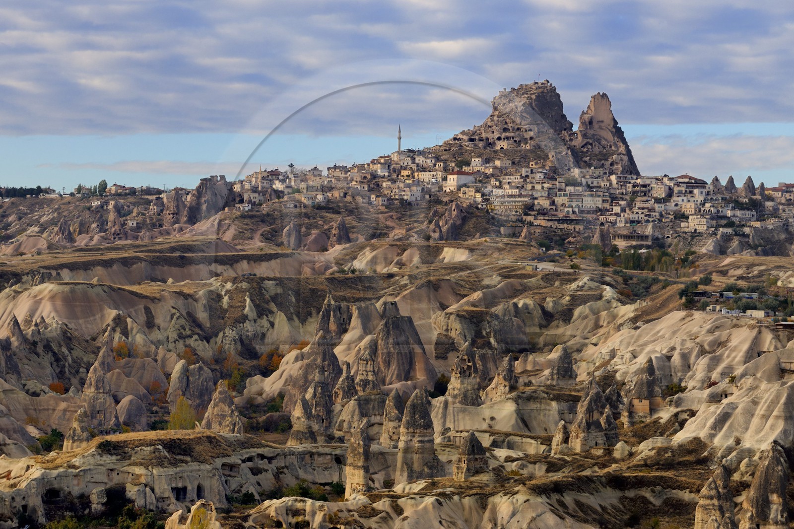 Turkey, Central Anatolia, Nevsehir Province, Cappadocia listed as World Heritage by UNESCO, the village of Uchisar and fairy chimneys (aerial view)
