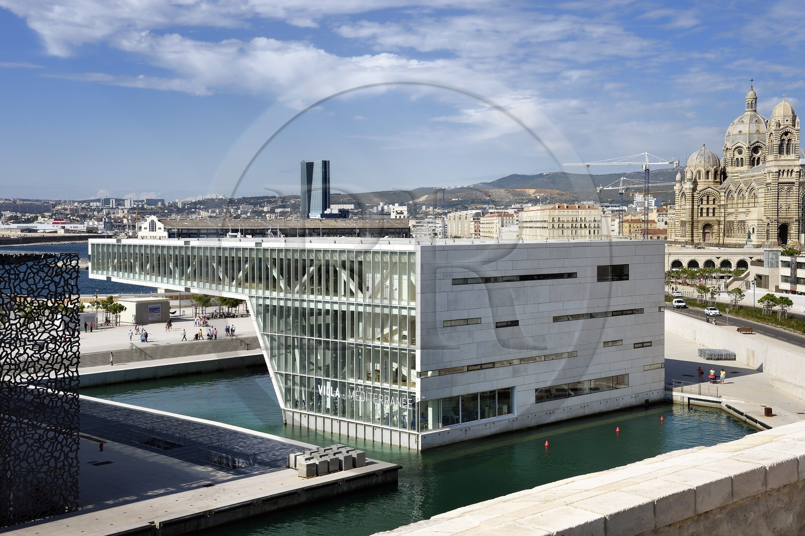 France, Bouches du Rhone, Marseille, Euromediterranee area, J4 Esplanade, La Villa Mediterranean, architect Stefano Boeri, La Major Cathedral (19th century) and the CMA CGM tower by architect Zaha Hadid in the background