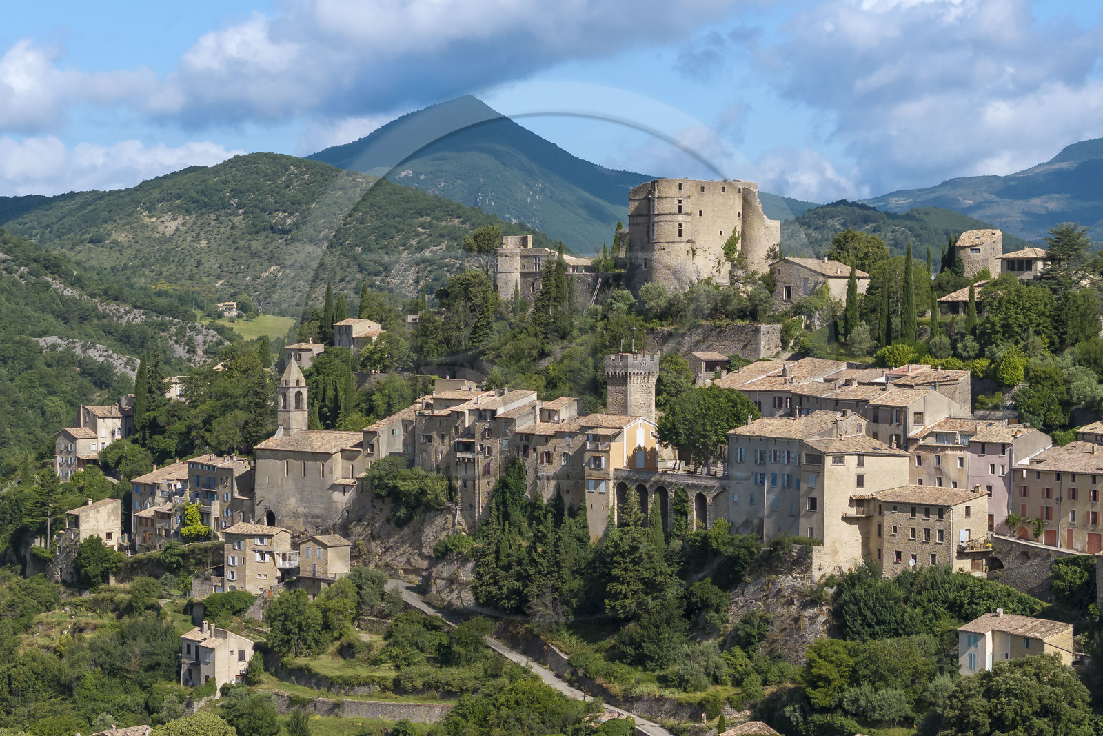 France, Drome, regional natural park of Baronnies provencales, Montbrun les Bains, labeled the Most Beautiful Villages of France, the village and the Renaissance castle of Dupuy-Montbrun (aerial view)