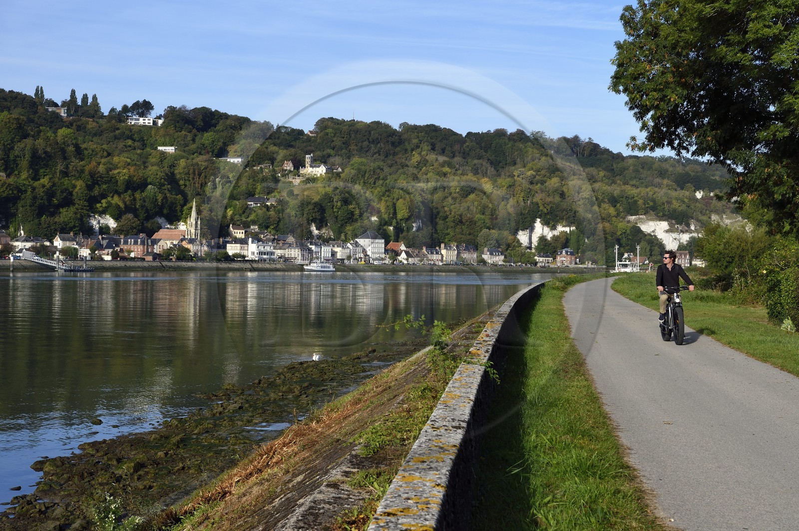 France, Seine-Maritime, the village of La Bouille in the norman Seine river meanders, cyclist on the veloroute