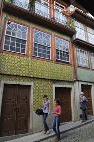 Portugal, Minho region, Guimaraes, town listed as World Heritage by UNESCO, home with tiles in the street das Trinas