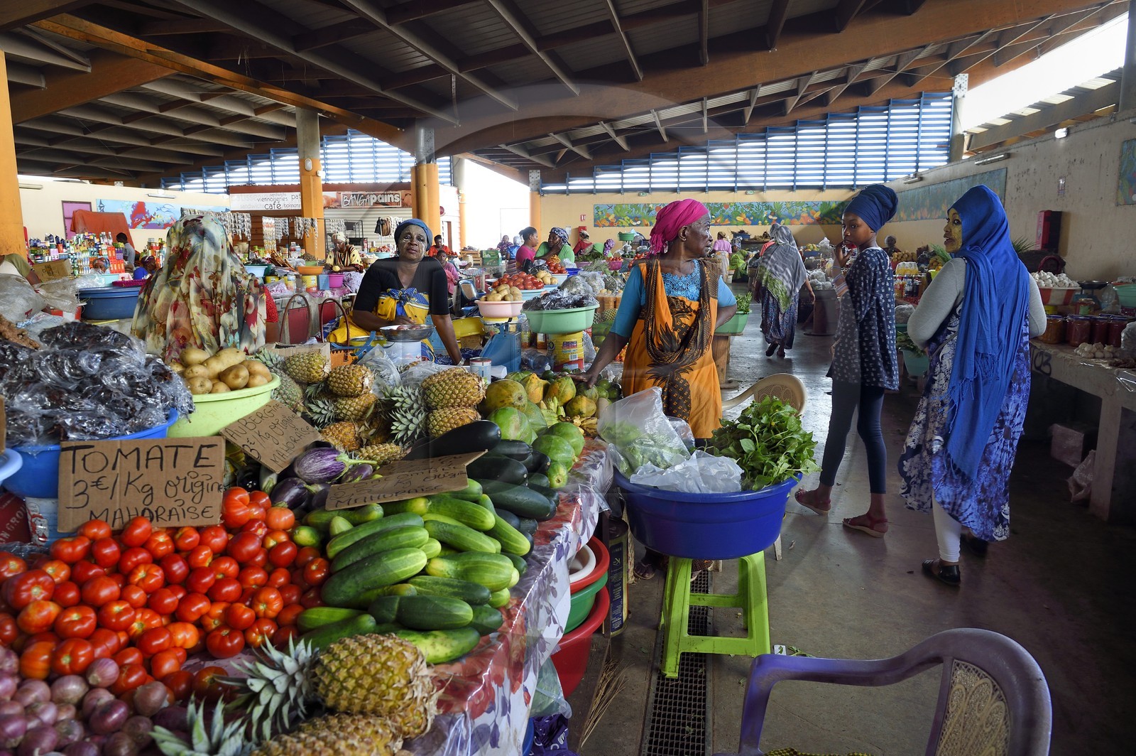 France, Mayotte island (French overseas department), Grande-Terre, Mamoudzou, large central market at the port, Mahorais women wearing a facial mask with sandalwood (the m'sindzano) behind their fruits and vegetables stalls