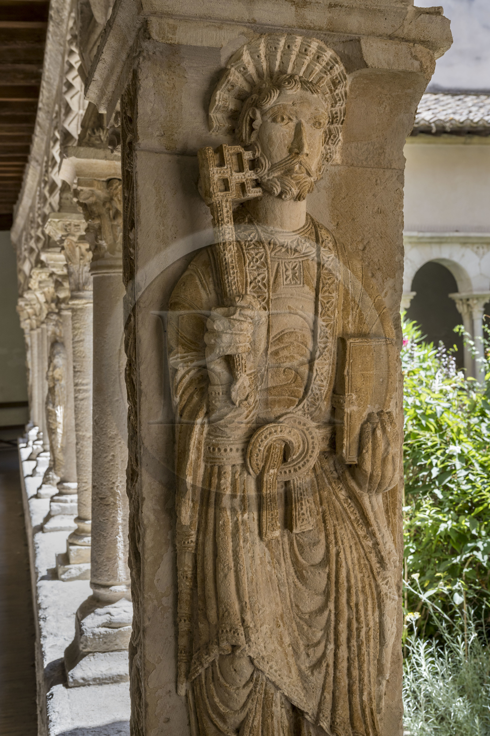 France, Bouches du Rhone, Aix en Provence, Saint Sauveur Cathedral (12th to 16th century), Romanesque cloister from the end of the 12th century, on the north-eastern pillar the representation of Saint Peter who holds in his right hand the large key to the holy book, the Bible, held in his left hand