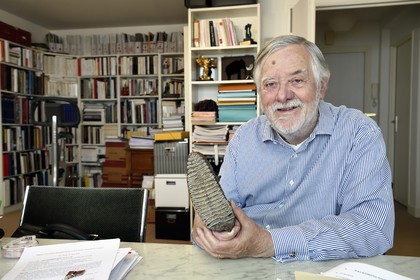 France, Paris, the french paleontologist and paleoanthropologist Yves Coppens, professor at the College de France, in the office of his home in Paris, it has a mammoth tooth he found in Siberia during one of his expeditions