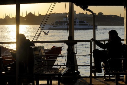 Turkey, Istanbul, ferry crossing the Bosphorus Strait, in the background Sultan Ahmet Camii Mosque (Blue Mosque), Hagia Sophia Basilica and Topkapi Palace in Sultanahmet District listed as World Heritage by UNESCO