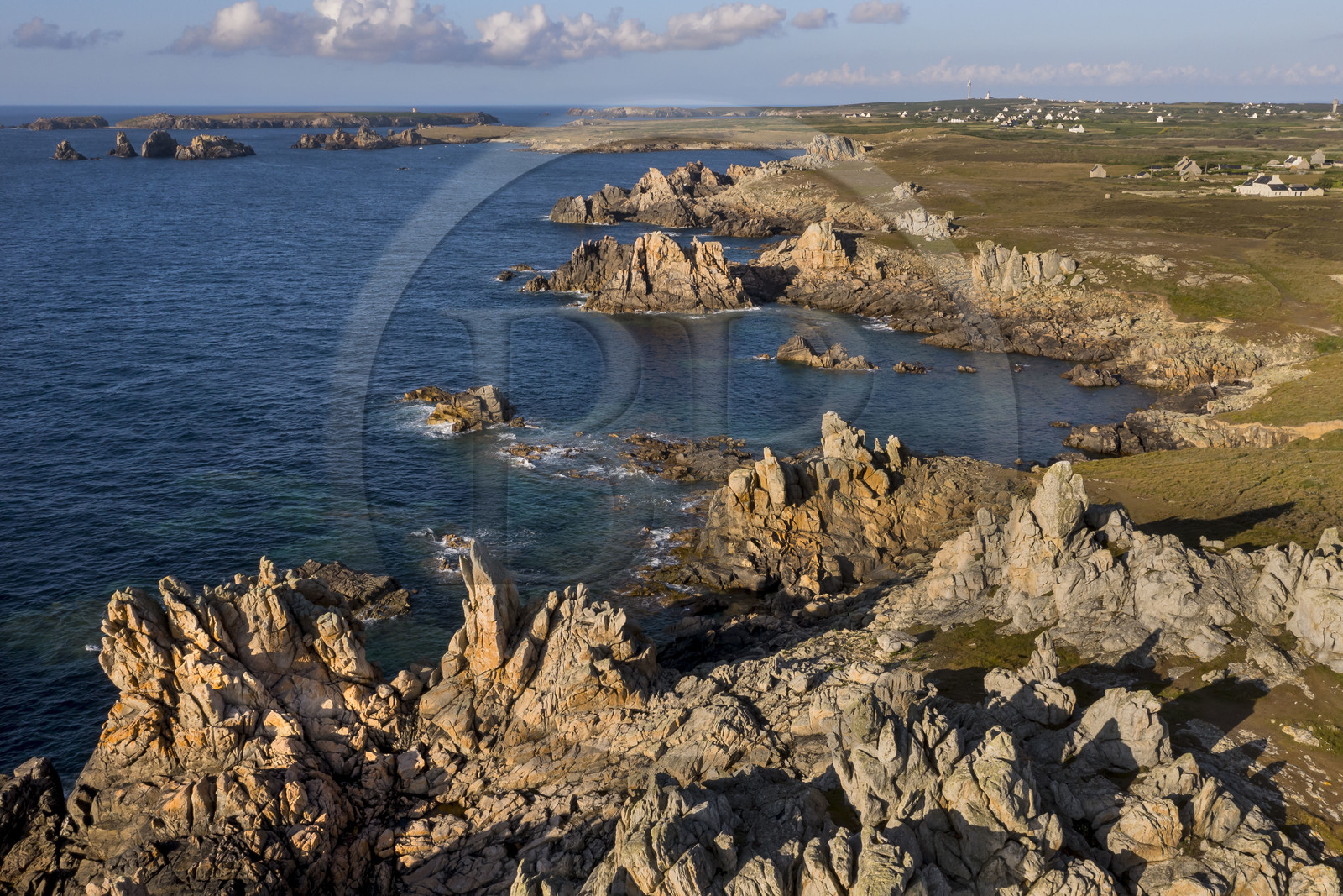 France, Finistère, Iroise Sea, Ouessant Island, the rocks of the jagged coast in the North of the Island at the Creac’h lighthouse (aerial view)