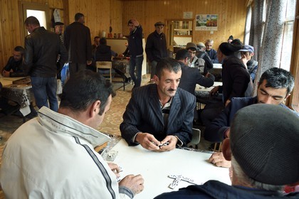 Azerbaijan, Ismailli region, Lahij (Lahic), domino players in the cafe