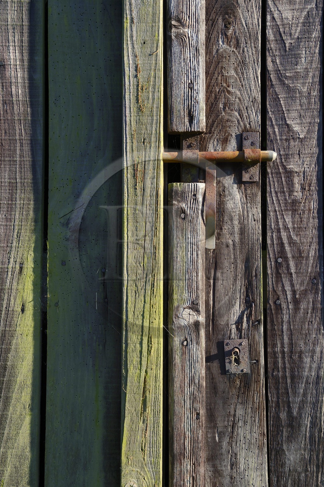 France, Morbihan, wooden barn door with lock