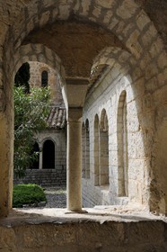 France, Herault, Medieval town of Saint-Guilhem-le-Desert, a stop on el Camino de Santiago, pilgrimage route to Compostela, labelled Les Plus Beaux Villages de France (The Most Beautiful Villages of France), abbey of Gellone from the 11th century listed as World Heritage by UNESCO, the cloister