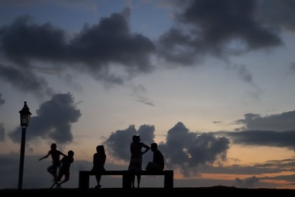 Sri Lanka, Southern Province, Galle Fort, listed as World heritage by UNESCO, family on the ramparts at sunset