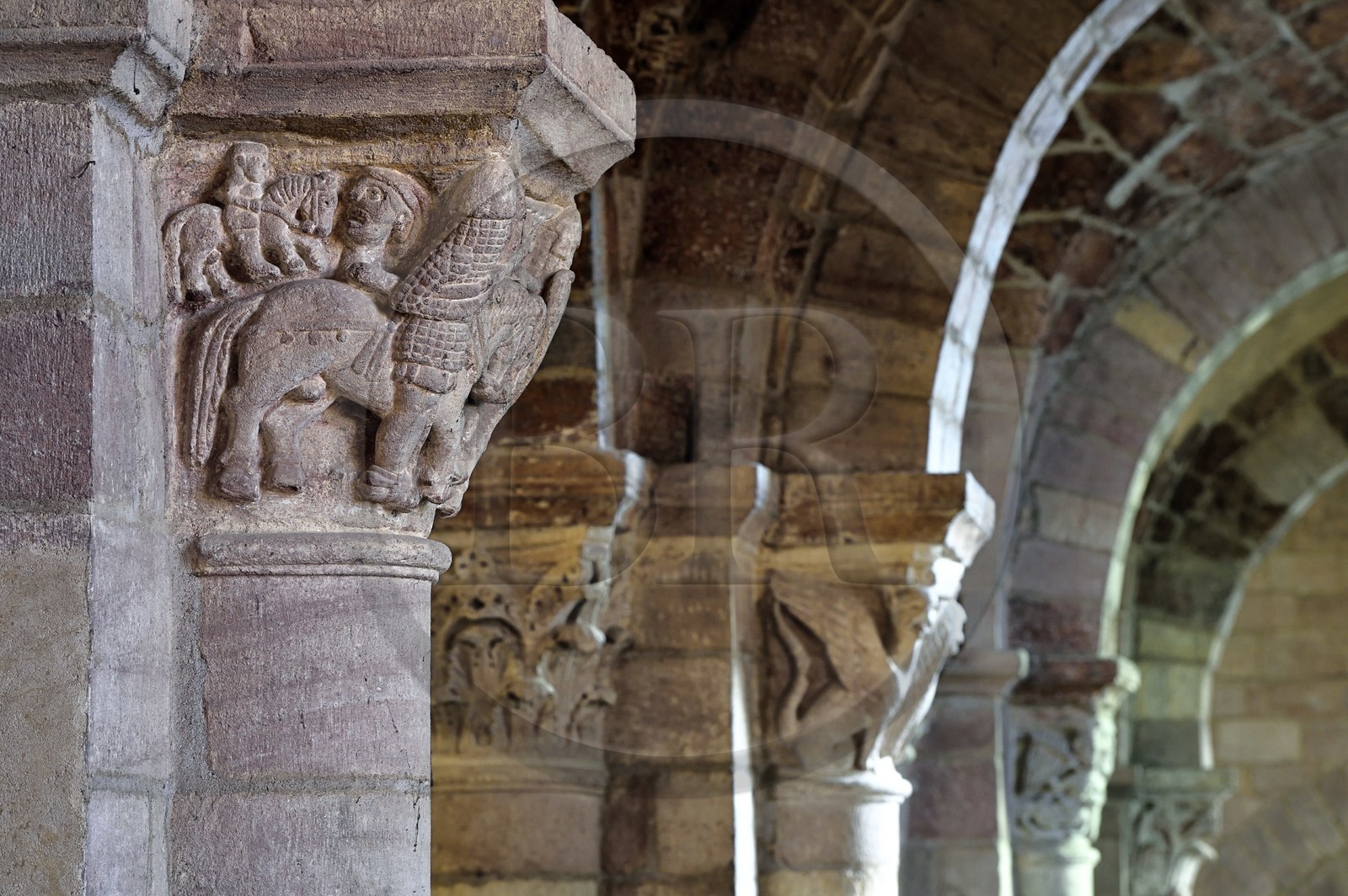 France, Haute Loire, Brioude, the Basilica of Saint-Julien de Brioude in Auvergne Romanesque style, carved capitals decorated with patterns, fight between a Christian knight and a Buckwheat knight which could refer to the Crusades