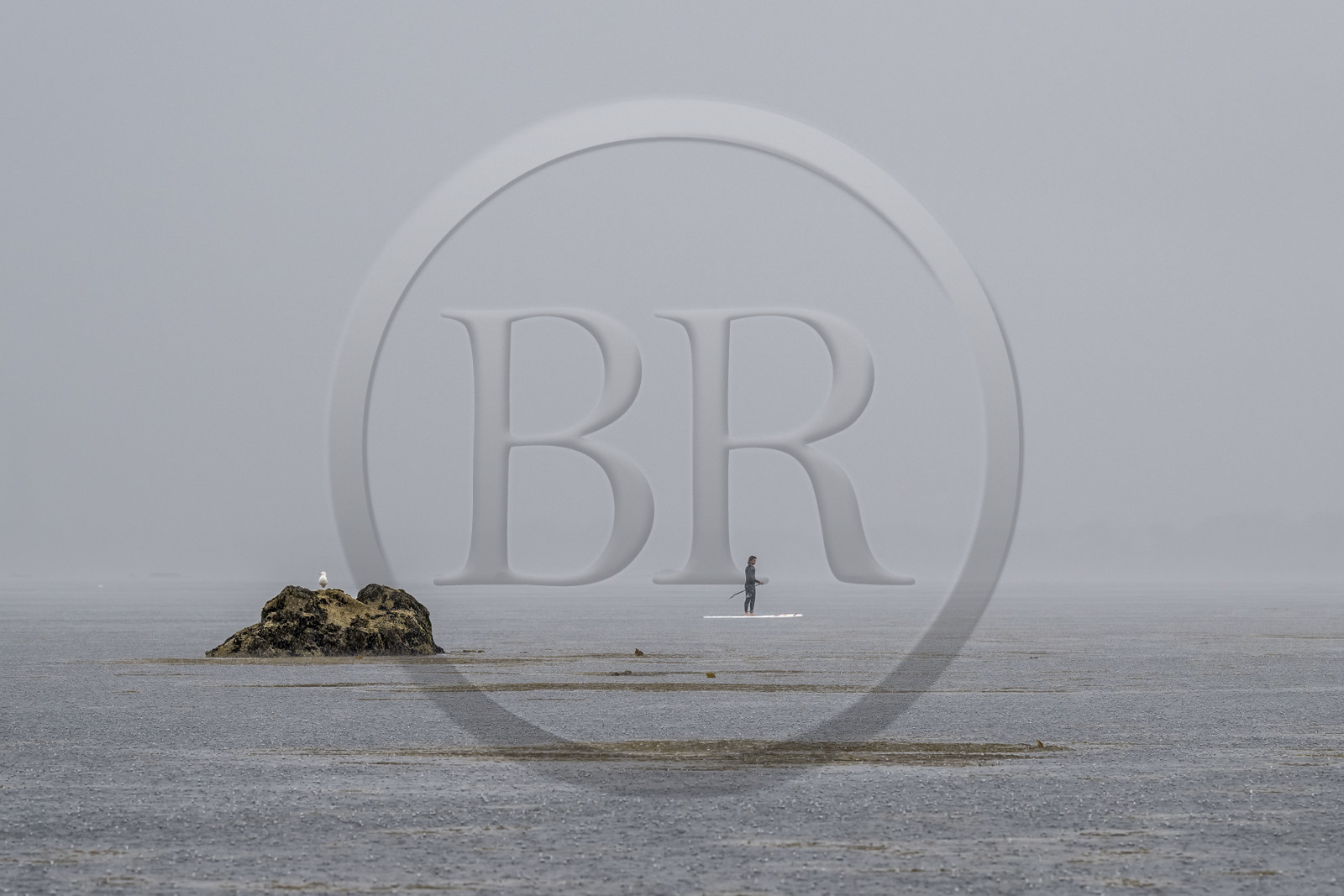 France, Finistère, Penmarch, Étocs archipelago, stand up paddle in the rain