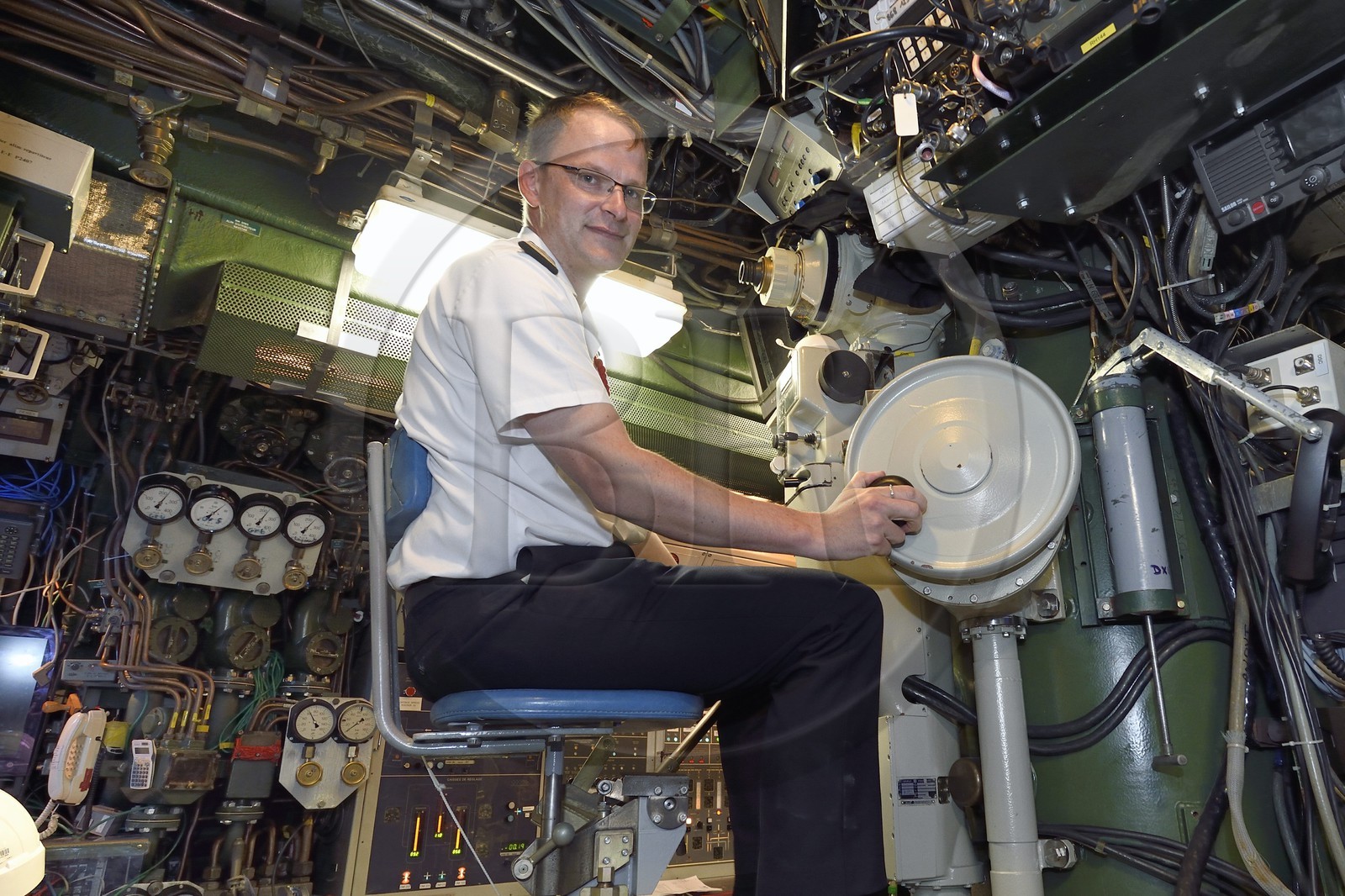France, Var, Toulon, the naval base (Arsenal), Commander Nicolas Faure at periscope in the central navigation and operation room, Commander of the nuclear attack submarine (SNA) Casabianca (Rubis type)