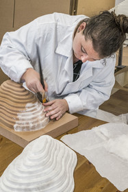 France, Gard, Bagard, Atelier Sericyne, production of exceptional and non-woven silk for the creation of decorative and lifestyle objects in silk, placement of a piece of silk threads on a mold with brush and water application, Hélène Gauthier in charge of production