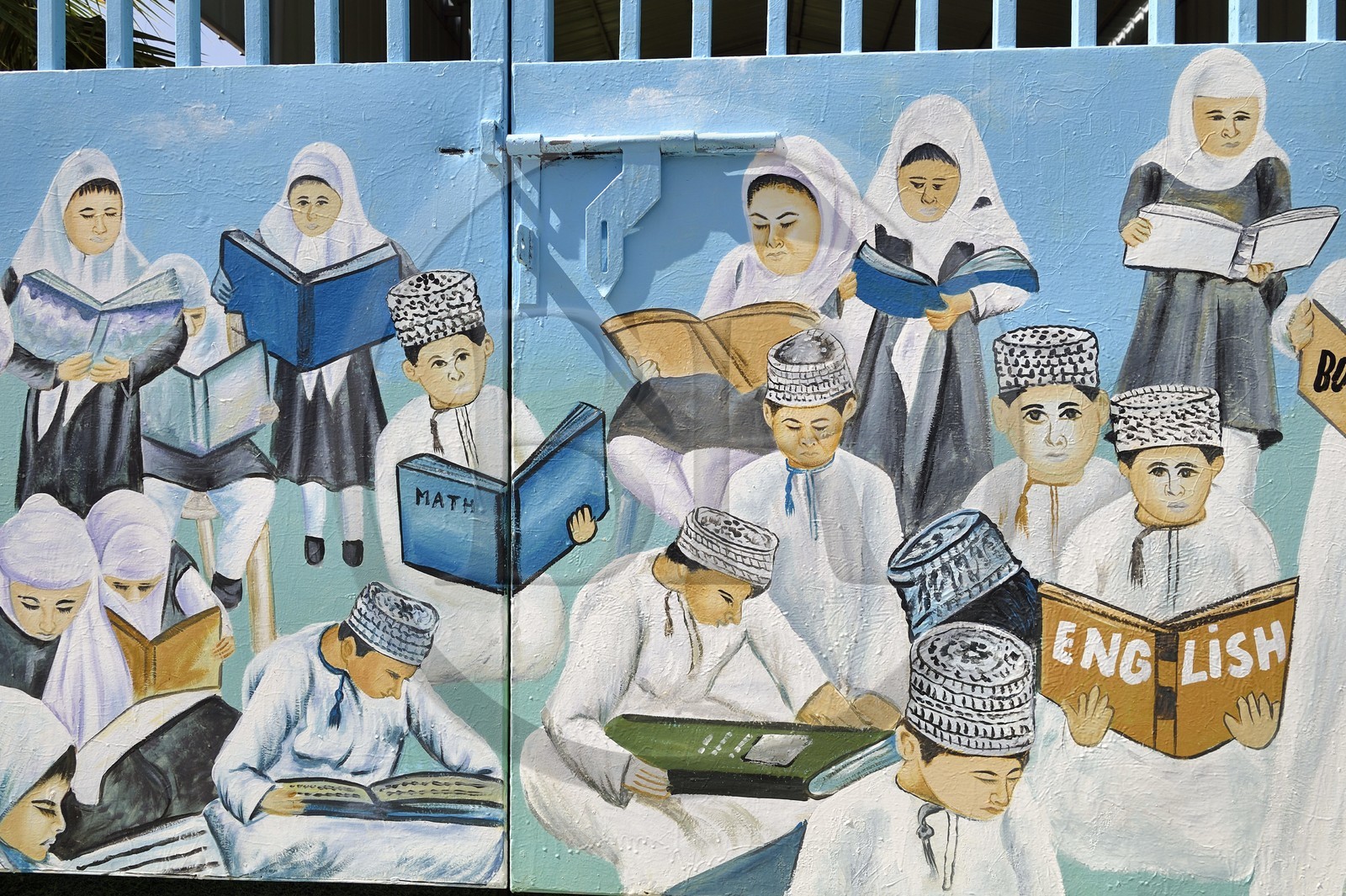 Sultanate of Oman, governorate of Al Batina, Nakhl, wall painting on the door of a school depicting children studying