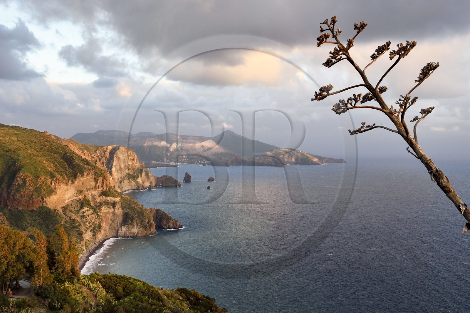 Italy, Sicily, Aeolian Islands, listed as World Heritage by UNESCO, Lipari Island, the cliffs of the southwest coast of the island at Quattrocchi facing the Vulcano Island in the background