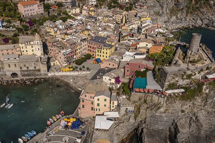 Italy, Liguria, Cinque Terre National Park listed as World Heritage by UNESCO, village of Vernazza and its port (aerial view)