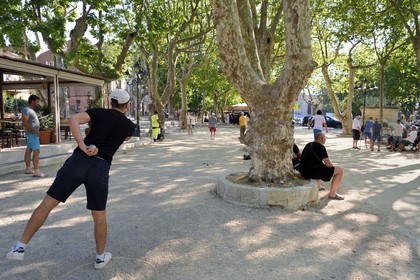 France, Var, Saint-Tropez, petanque players on the Place des Lices at night