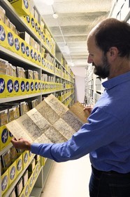 France, Puy de Dome, Clermont Ferrand, L'Aventure Michelin archives, museum retracing all the activities of the Michelin group, Stéphane Nicolas, responsible for historical heritage at Michelin, presents the very first 1908 test map of the Clermont-Ferrand region