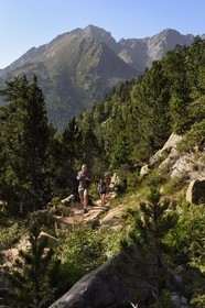 France, Hautes Pyrenees, Saint Lary Soulan and Aragnouet, Neouvielle National Nature Reserve, Neouvielle lakes hike, hikers climbing to the Lacs des Laquettes