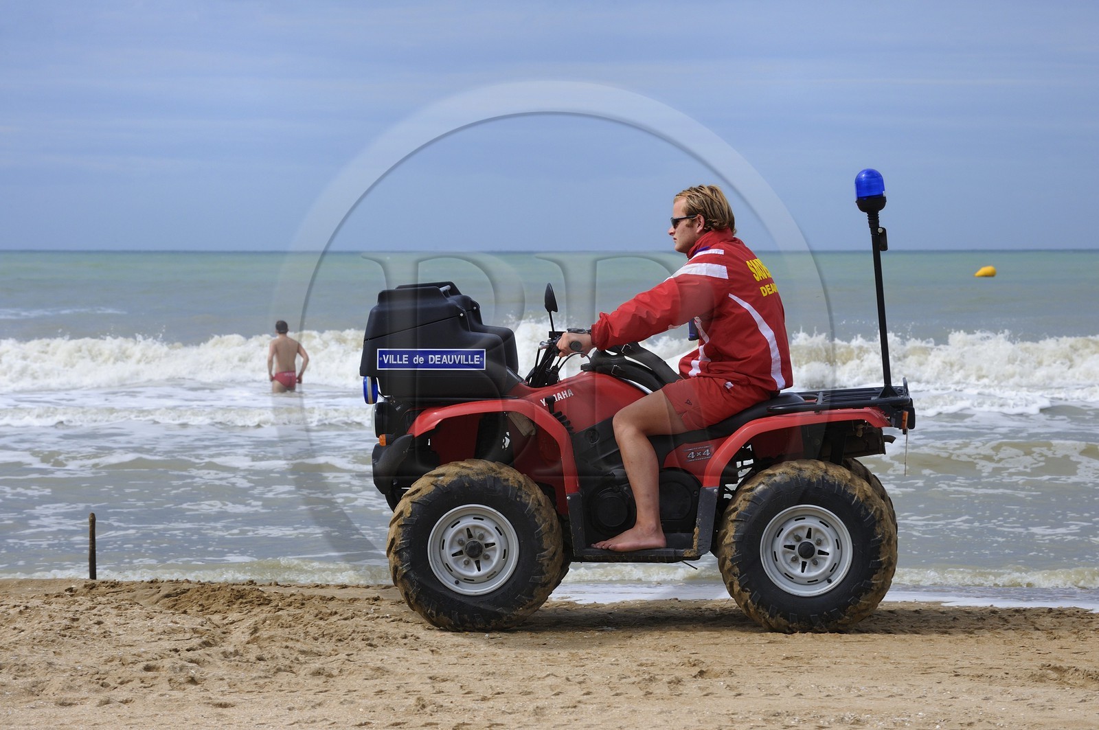 France, Calvados, Pays d'Auge, Deauville, lifeguard on the beach on a quad
