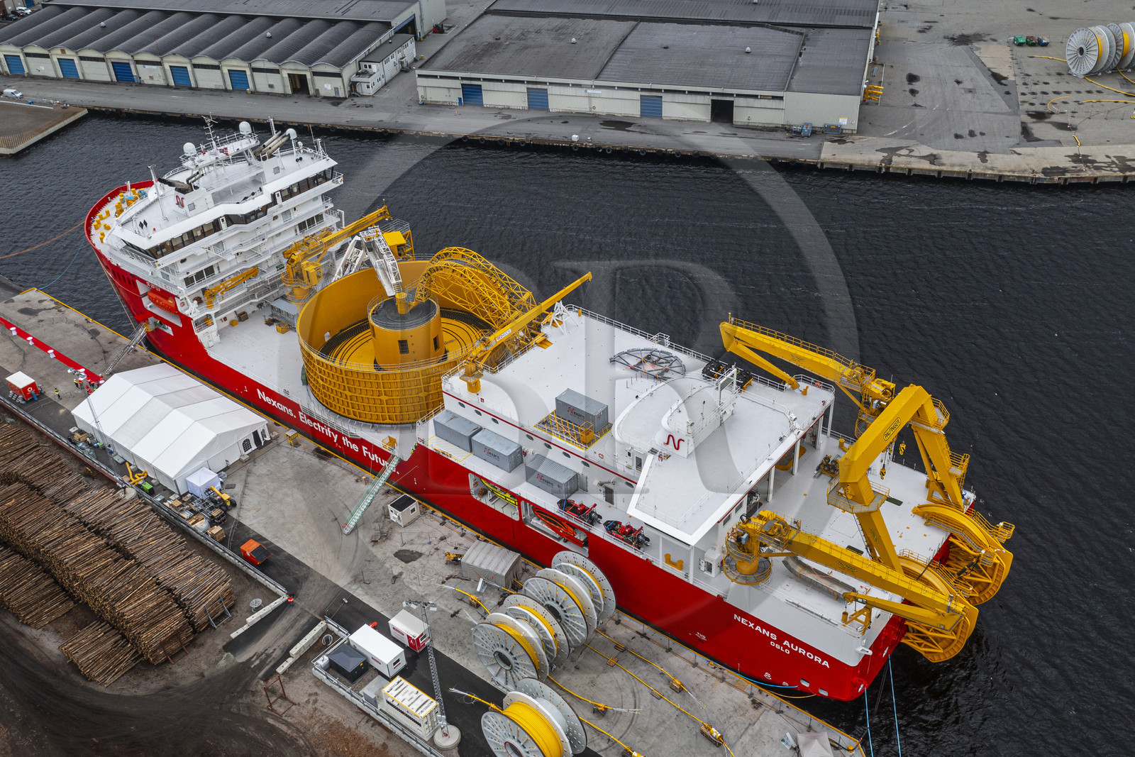 Norway, Ostfold County, Halden, Nexans Aurora cable-laying vessel, vessel for laying electric cables, connecting and repairing these cables, in the center the turntable which has the capacity to carry up to 10,000 tonnes of cables (aerial view)