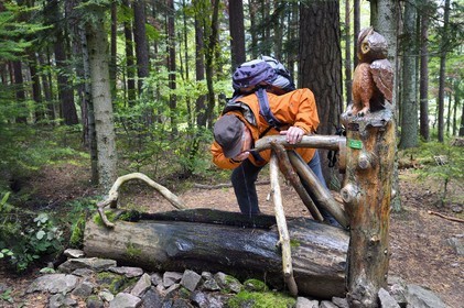 France, Haut Rhin, Thannenkirch, hiking in the Taennchel massif, Hubert Bihl of the Club Vosgien in front of a sculpted fountain