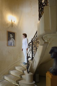 France, Alpes Maritimes, Cannes, the Villa La Californie where Picasso lived, today renamed the Pavillon de Flore by Marina Picasso, Marina Picasso granddaughter of Picasso looking at a picture of a young Pablo Picasso