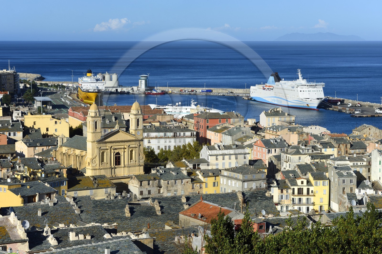 France, Haute Corse, Bastia, St Jean Baptiste Church and the commercial harbor in the background