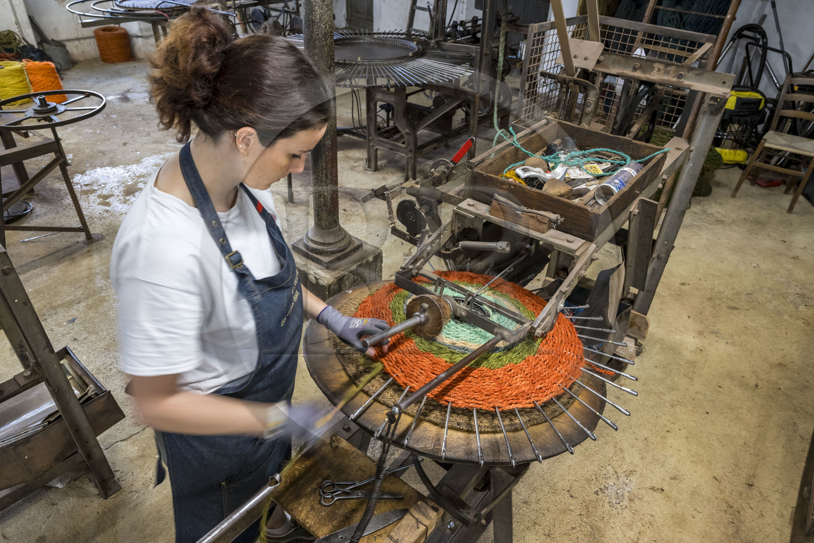 France, Drome, Drome provencale, Nyons, La Scourtinerie, the last scourtin factory in Provence, traditional filters used in the production of olive oil but also designed today as decorative objects made of coconut fiber, manufacturing of scourtins in their workshop on custom-made circular looms