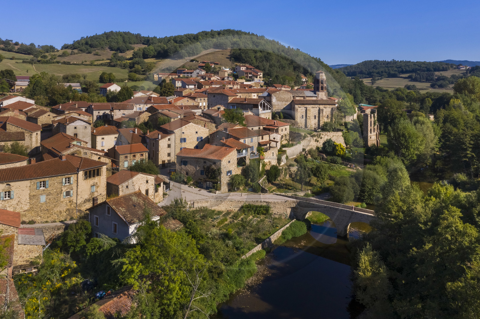 France, Haute Loire, Lavaudieu, labelled Les Plus Beaux Villages de France (The Most Beautiful Villages of France), the former Saint Andre (St Andrew) abbey in Auvergne Romanesque style and the old bridge over Senouire river (aerial view)