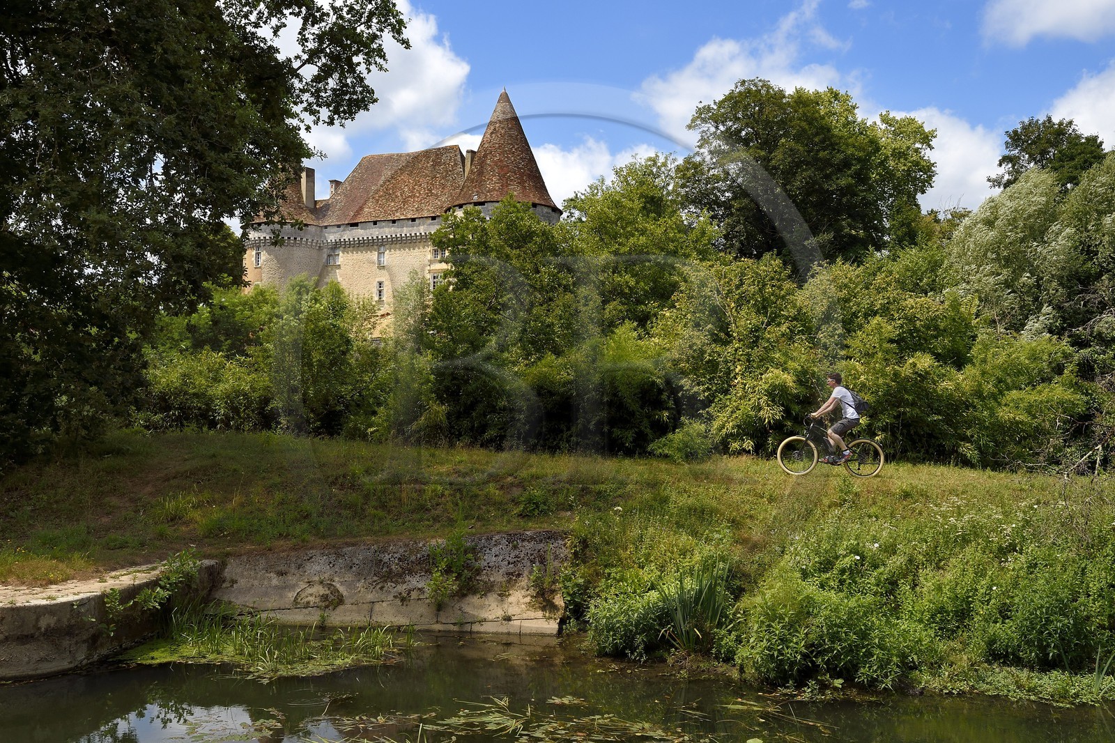 France, Dordogne, Perigord Blanc, Douzillac near Neuvic, Mauriac castle along the river Isle that follows the Greenway cycle route (Veloroute Voie verte)