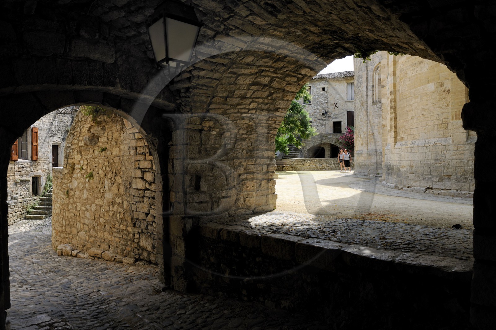 France, Herault, Pic Saint-Loup region, Saint-Martin-de-Londres, passage under arches around the church