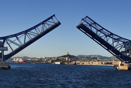 France, Bouches du Rhone, Marseille, Euroméditerranée Zone, Great Seaport of Marseille, the Pinede bridge (bascule mobile bridge) and Notre-Dame de la Garde in the background