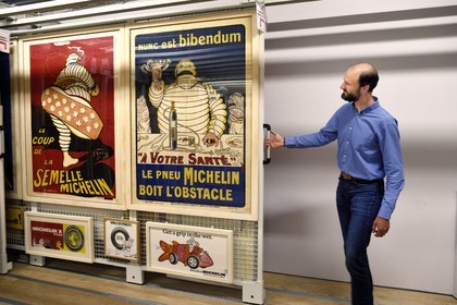 France, Puy de Dome, Clermont Ferrand, L'Aventure Michelin archives, museum retracing all the activities of the Michelin group, collection poster room in the archives, Stéphane Nicolas, responsible for Michelin's historical heritage, presents Bibendum that is Michelin's mascot created in 1898, posters created by graphic designer O'galop