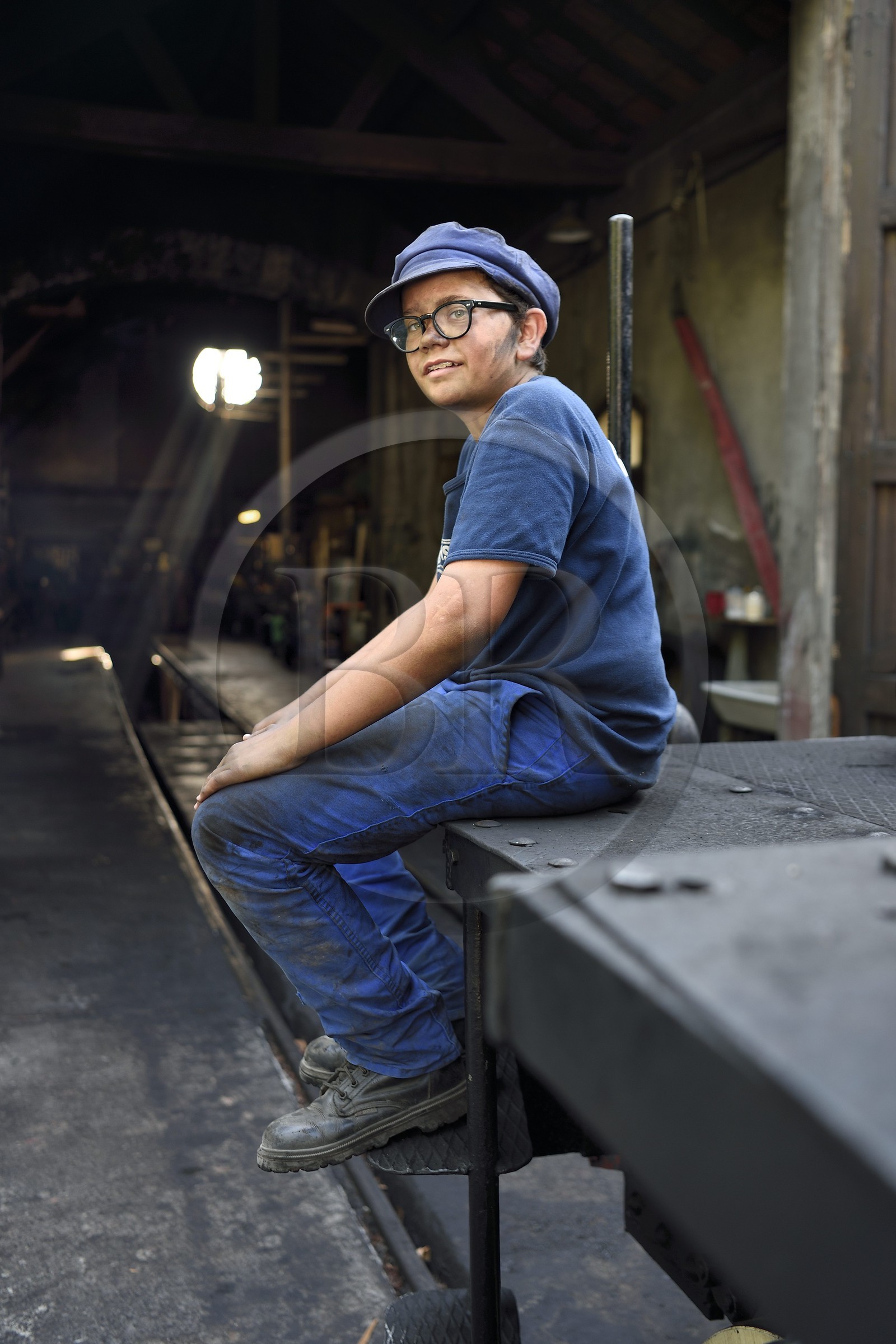 France, Alpes-Maritimes, Puget Theniers, steam engine warming up, Benoit Prudhomme-Lacroix Lacroix is one of the youngest volunteers of the G.E.C.P. that restores and operates the Train des Pignes, outside the maintenance workshop at the motive power depot