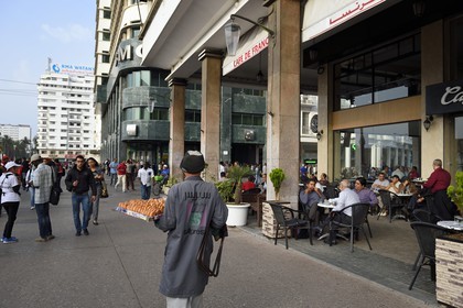 Morocco, Casablanca, the Café de France on the avenue Hassan II and the Moretti-Milone building on United Nations square (place des Nations-Unies) in the background