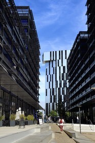 France, Bas Rhin, Strasbourg, development of port du Rhin (Rhine's harbour) and conversion of breakwater of Bassin d'Austerlitz, presqu'ile Malraux (Malraux peninsula), buildings the Black Swans by architect Anne Demians and the Elithis tower in the background