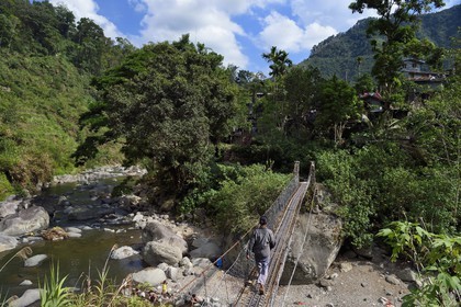 Philippines, Ifugao province, Banaue region, suspension bridge that leads to the village of Cambulo