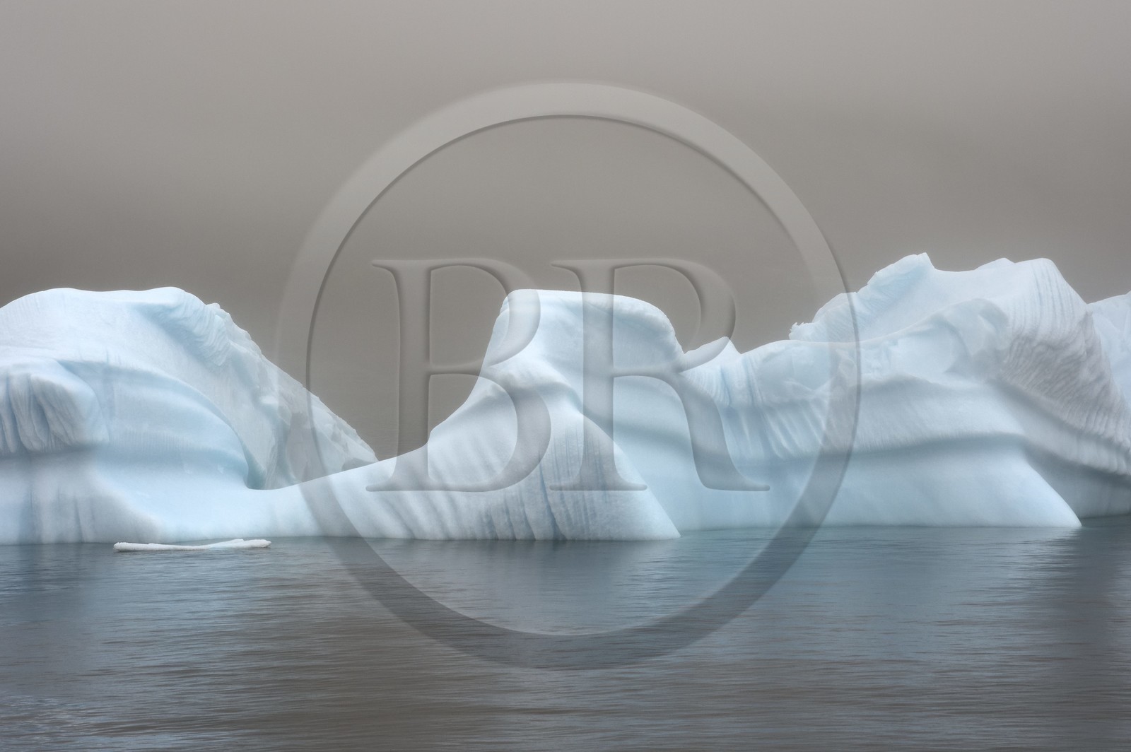 Greenland, west coast, Disko Island, iceberg in the mist off Qeqertarsuaq