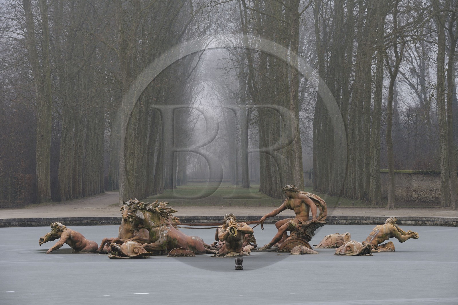 France, Yvelines, Chateau de Versailles, listed as World Heritage by UNESCO, Apollo basin in the winter fog