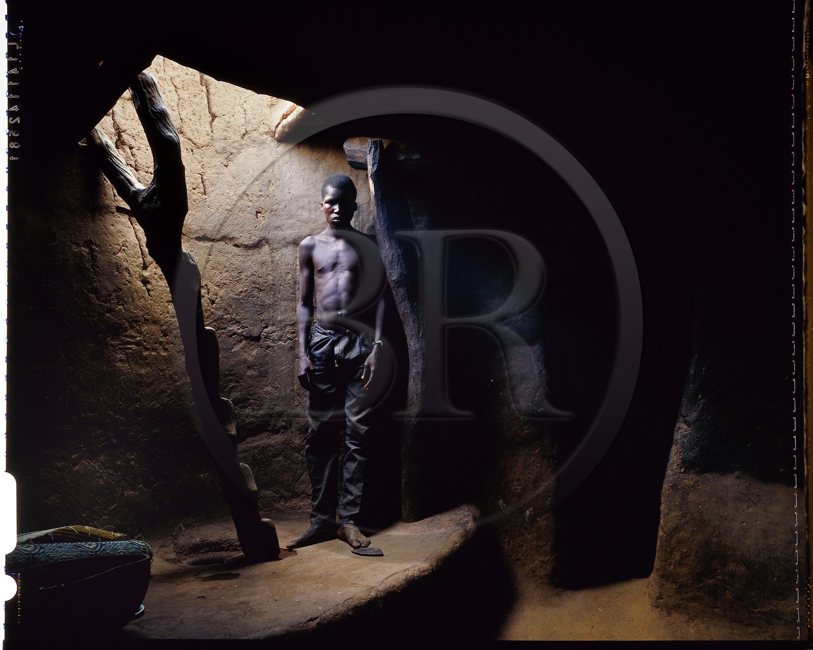 Burkina Faso, Poni province, Lobi land, Loropéni, inside a Lobi house, one of the many interior accesses to the terrace by a ladder carved from a tree trunk